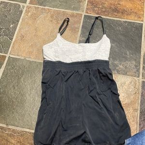 Lulu lemon tank top. Black and white stripes on top, dark grey on bottom.